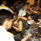 Police officers push protesters out to a nearby park to clear the main roads outside government headquarters.